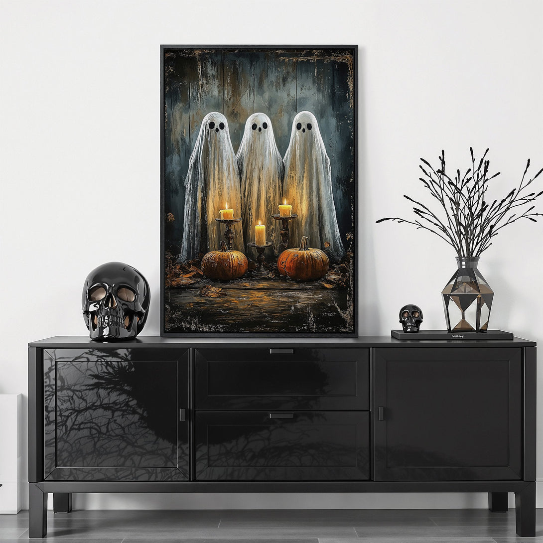 Framed Wall Art: Spooky Halloween scene with ghostly figures, pumpkins, and candles. Dark, moody color palette for a chilling aesthetic. Perfect for seasonal decor.