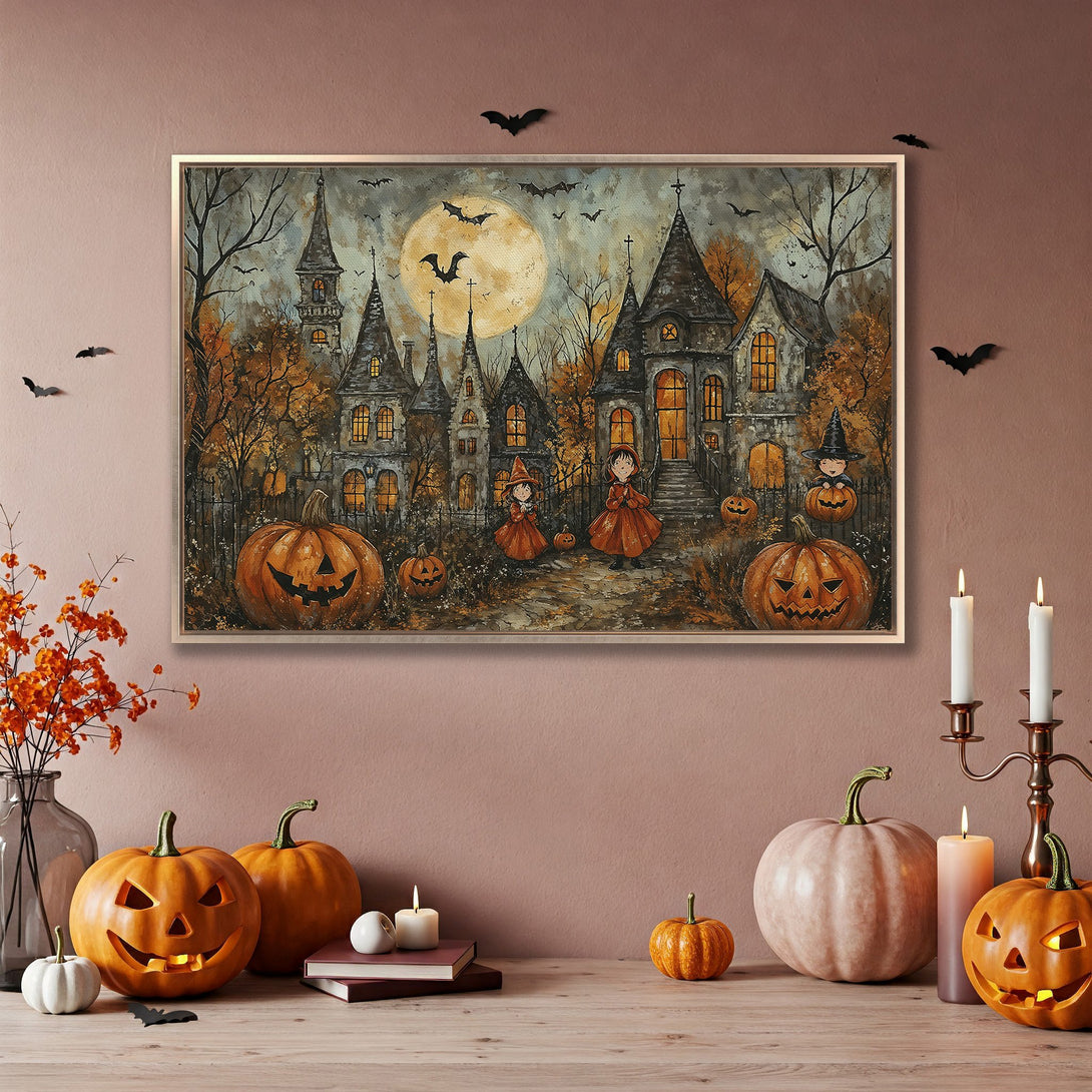Framed Wall Art: Spooky Halloween scene with haunted houses, pumpkins, and a full moon. Warm orange and gray color palette. Perfect for fall decor.