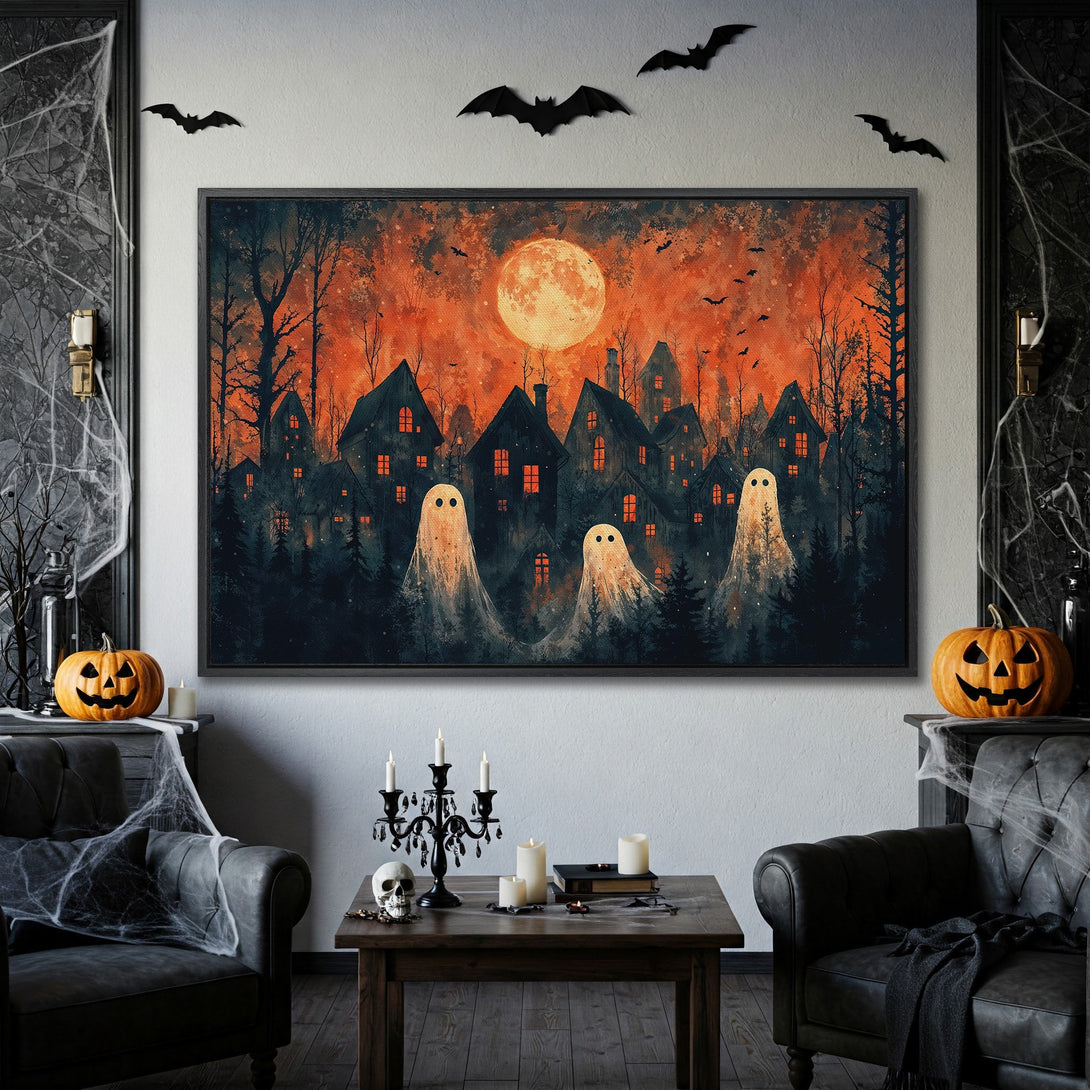 Framed Wall Art: Spooky Halloween canvas print with ghosts, houses, and a full moon in an orange and black color palette. Perfect for seasonal decor!