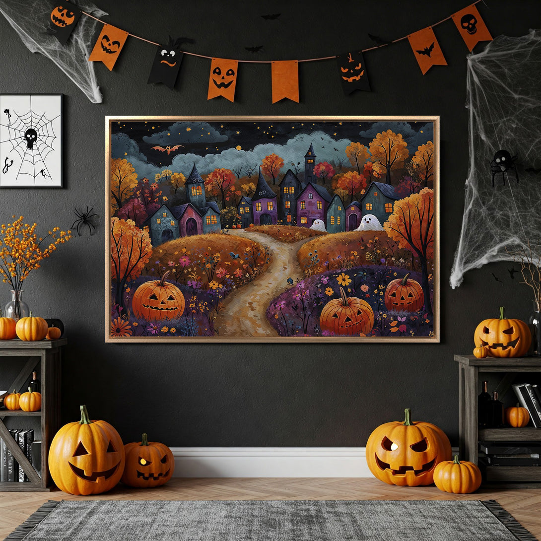 Framed Wall Art: Spooky Halloween village scene in warm autumn colors. Perfect for seasonal decor! Add a touch of whimsy with this canvas print.
