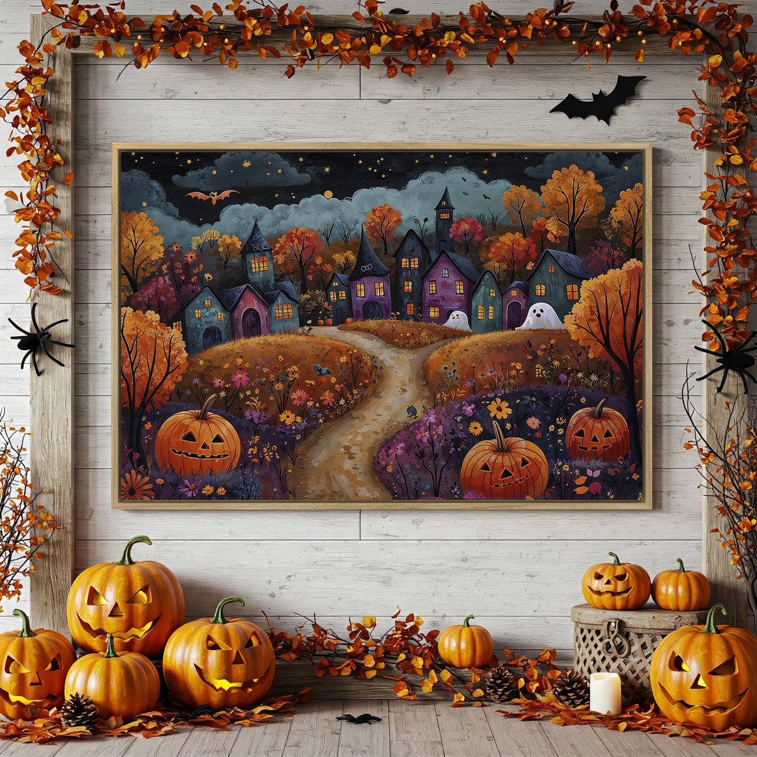 Framed Wall Art: Spooky Halloween village scene in warm autumn colors. Perfect for fall decor! Canvas Print with pumpkins, ghosts, and a bat.