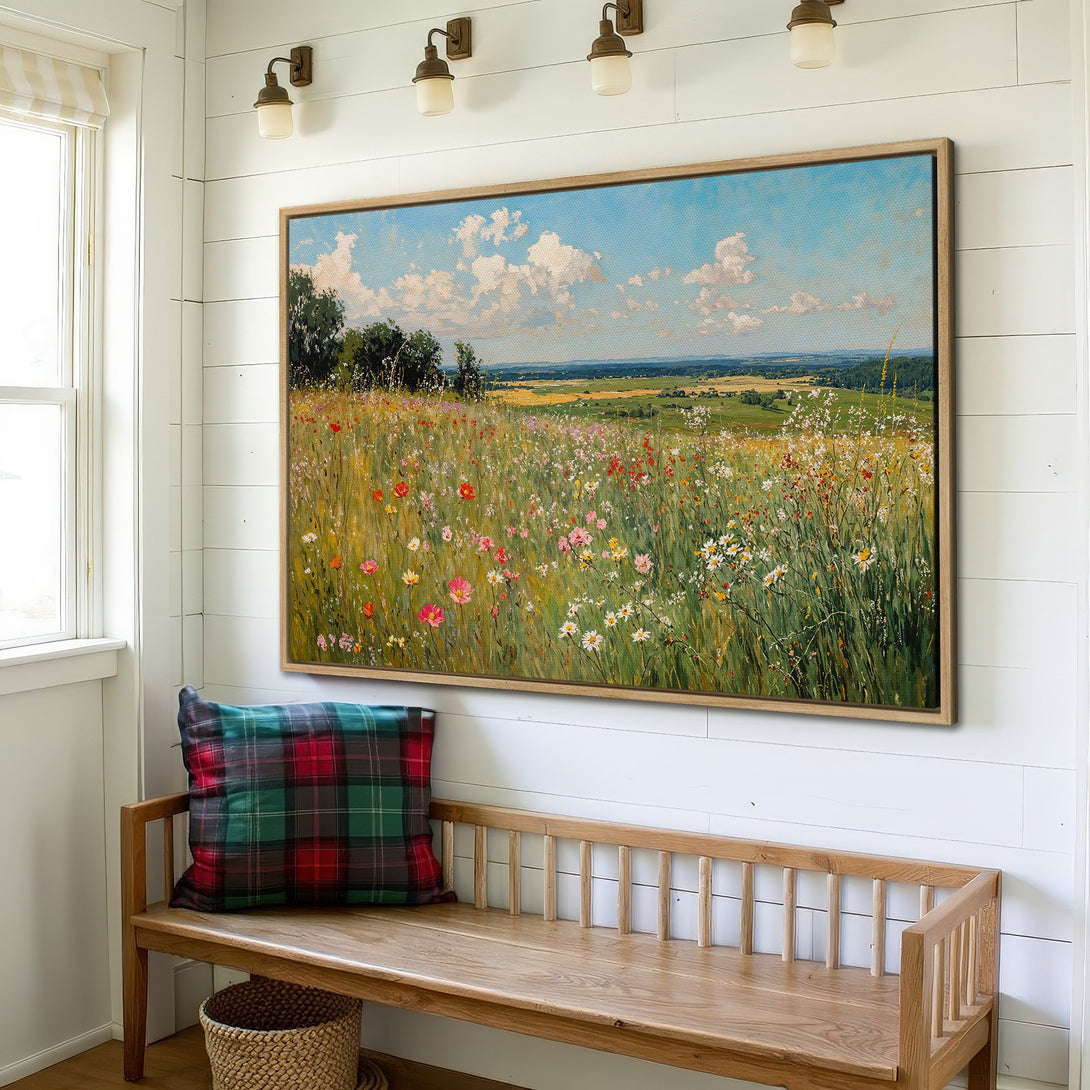 Framed Wall Art of a vibrant wildflower meadow with blue sky. Impressionistic style, featuring green, yellow, and pink hues. Perfect for adding a touch of nature.