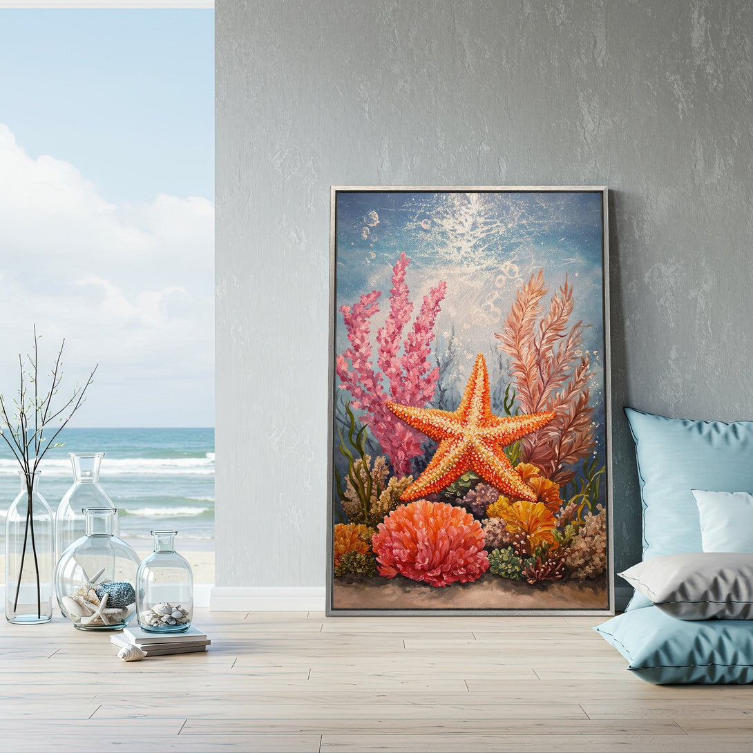 Framed Wall Art featuring a vibrant starfish and coral reef scene. Coastal style with a colorful palette of blues, pinks, and oranges. Perfect for beach decor.