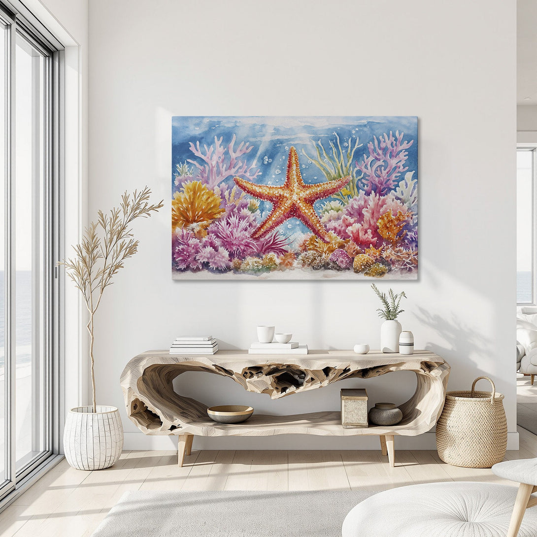 Framed Wall Art: Watercolor starfish and coral reef art in a coastal interior. Features a vibrant blue, pink, orange, and yellow color palette.
