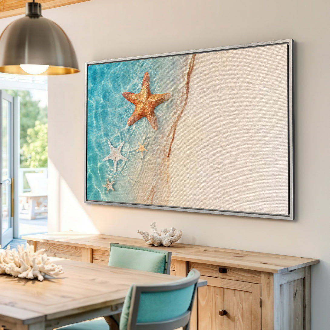 Framed Wall Art featuring a beach scene with starfish in a coastal style. Blue, beige, and orange color palette. Perfect for adding a touch of the ocean to your home!