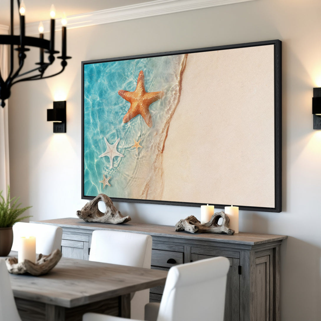 Framed Wall Art featuring a serene beach scene with starfish. Coastal style in blue, tan and orange hues, perfect for adding a touch of tranquility.