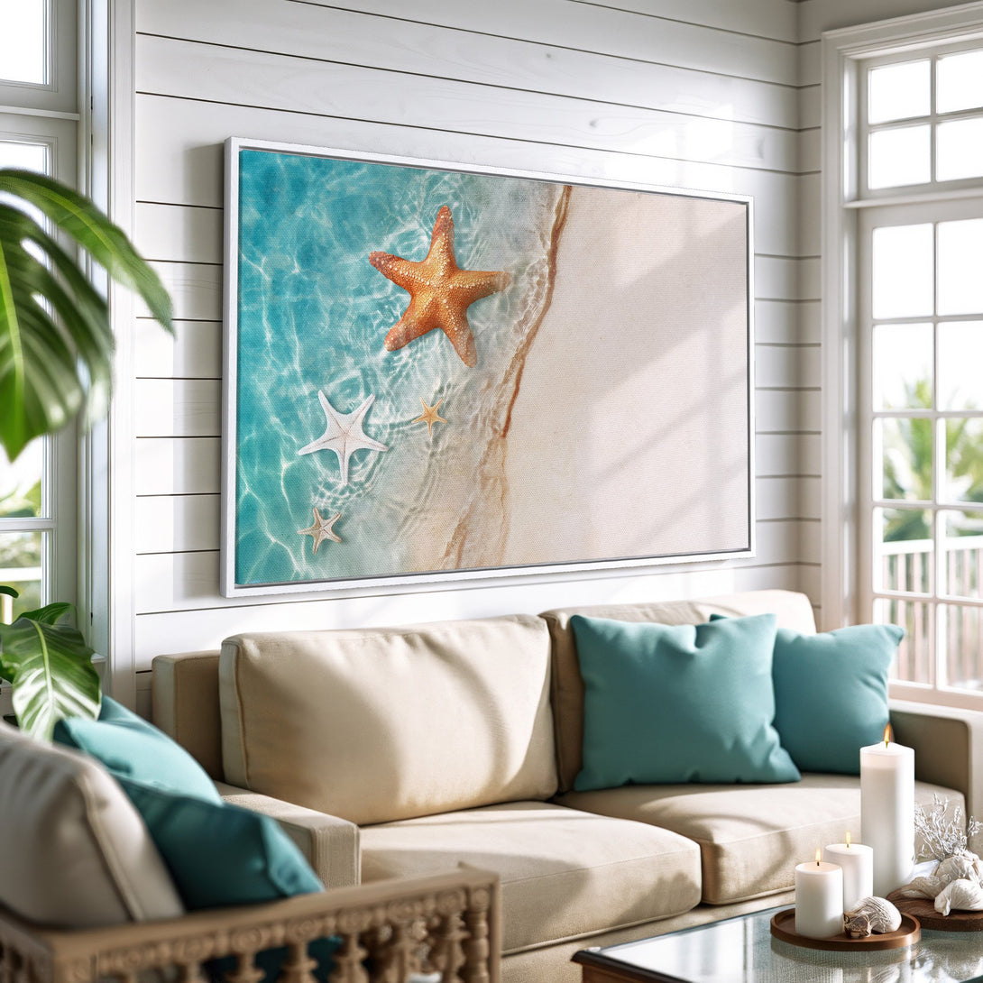 Framed Wall Art: Coastal scene with starfish on a beach. Tranquil blue, beige, and white color palette. Perfect for a relaxing living room.