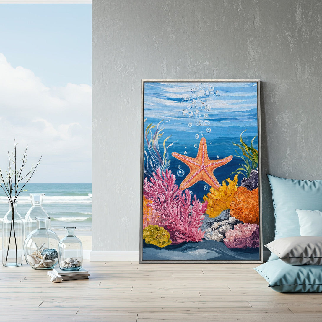 Framed Wall Art: Vibrant underwater scene Canvas Print with starfish, coral, and bubbles. Coastal art in blue, pink, orange, and yellow hues. Perfect for beach decor.
