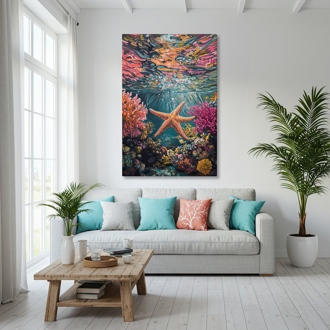 Framed Wall Art: Underwater starfish painting in a coastal living room. Vibrant coral reef art with a blue, orange, and teal color palette.