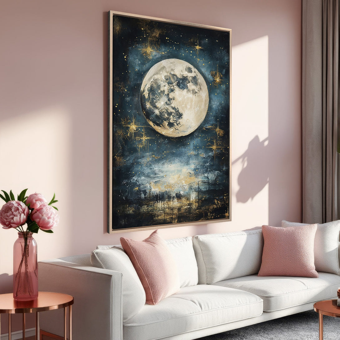 Framed Wall Art: Abstract moon painting in blue, gold, and white. Modern art decor in a stylish interior with a pink and gold color palette.