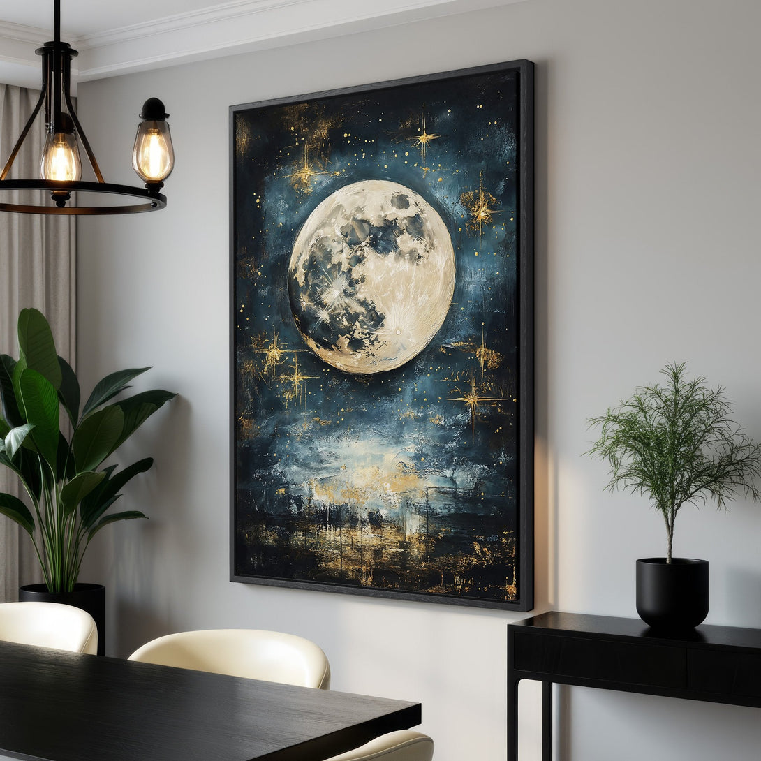 Framed Wall Art: Stunning moon and stars canvas print in a modern interior. Features a dark blue, gold, and white color palette. Perfect for adding a touch of celestial art.