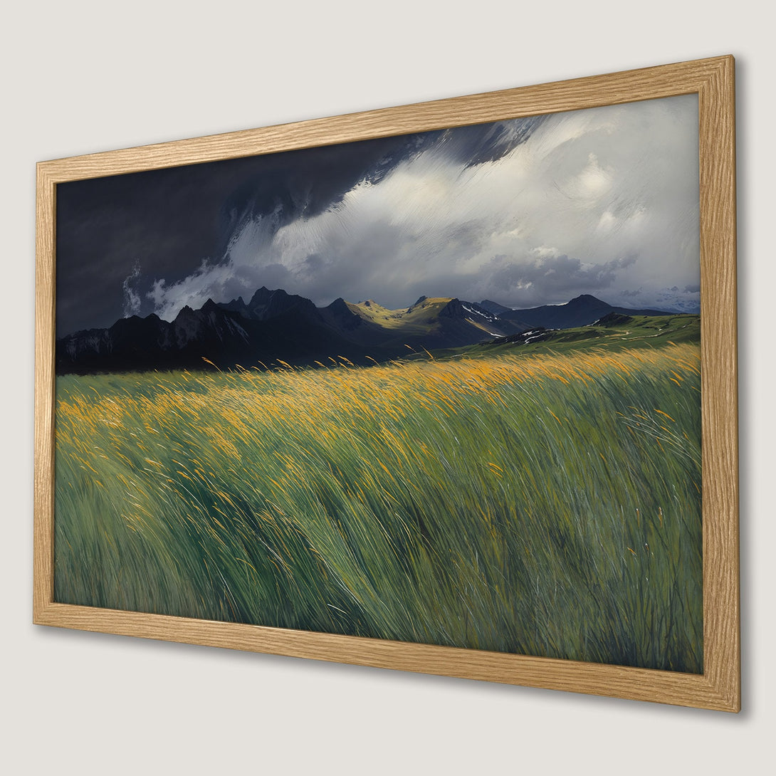 Framed Poster of a dramatic landscape with green and yellow grass, mountains, and a stormy sky.