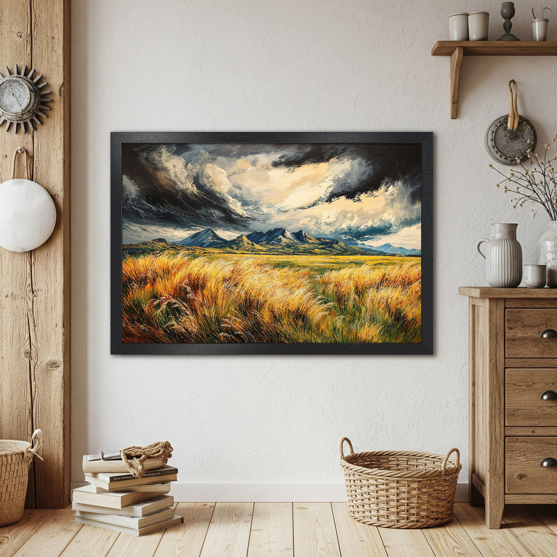 Framed Poster of a landscape painting. Features a field of golden grass, mountains, and dramatic sky. Warm color palette.
