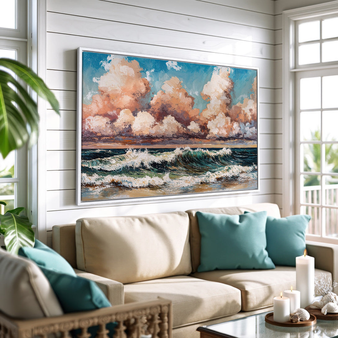 Framed Wall Art: Coastal scene canvas print with ocean waves and sunset clouds. Warm, inviting color palette of blues, oranges, and creams. Perfect for home decor.