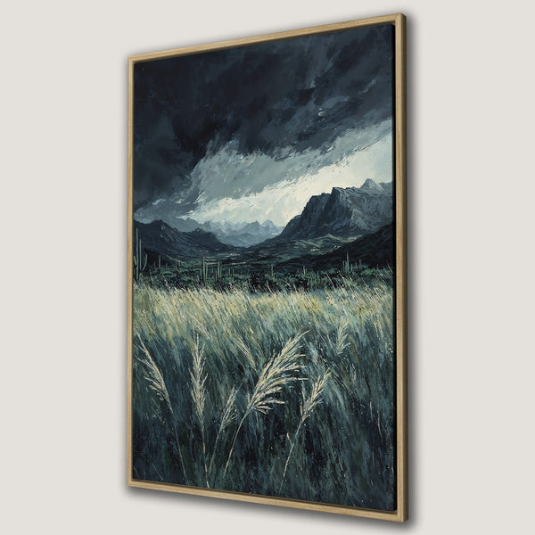 Framed Wall Art: Dramatic landscape Canvas Print featuring a stormy sky, mountains, and tall grass in a moody, dark blue and green palette. Perfect for home decor.