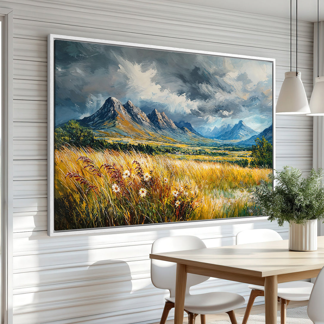 Framed Wall Art: Mountain landscape painting in warm yellow, blue, and grey tones. Impressionist style canvas print adds a touch of nature to any room.