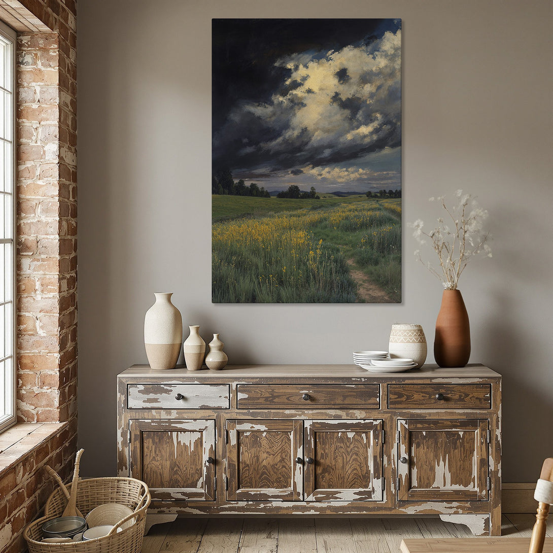 Framed Wall Art: Dramatic landscape Canvas Print with dark clouds, yellow flowers, and a path. Earthy tones, perfect for a dining room.