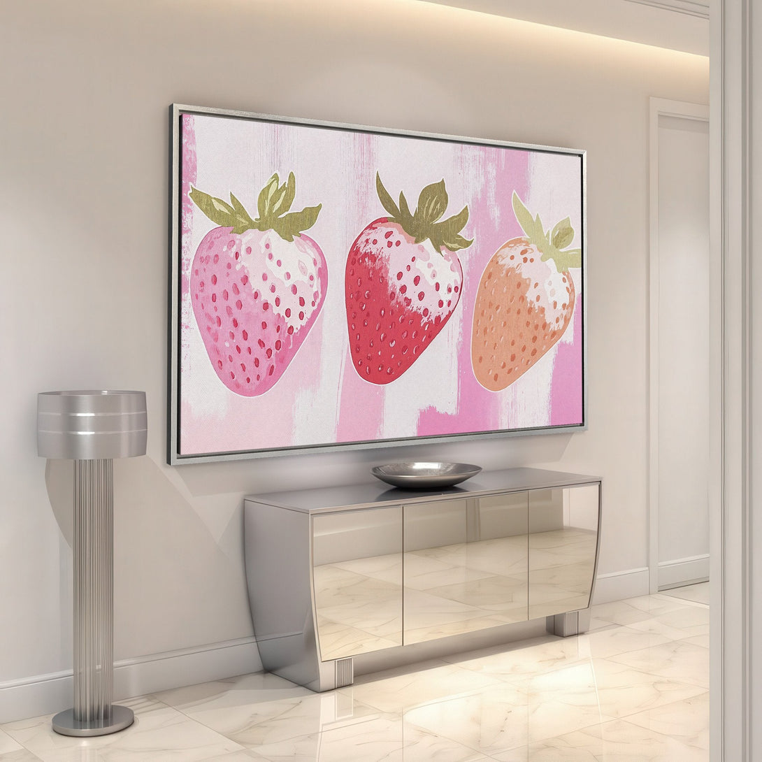 Framed Wall Art featuring vibrant strawberry painting in pink & red hues. Modern, stylish Canvas Print adds a pop of color to any interior space.