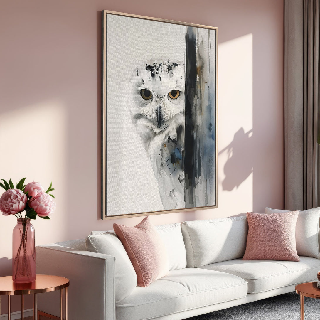 Framed Wall Art featuring a watercolor owl in a modern living room. Soft pink and neutral color palette. Perfect for adding a touch of nature to your home.