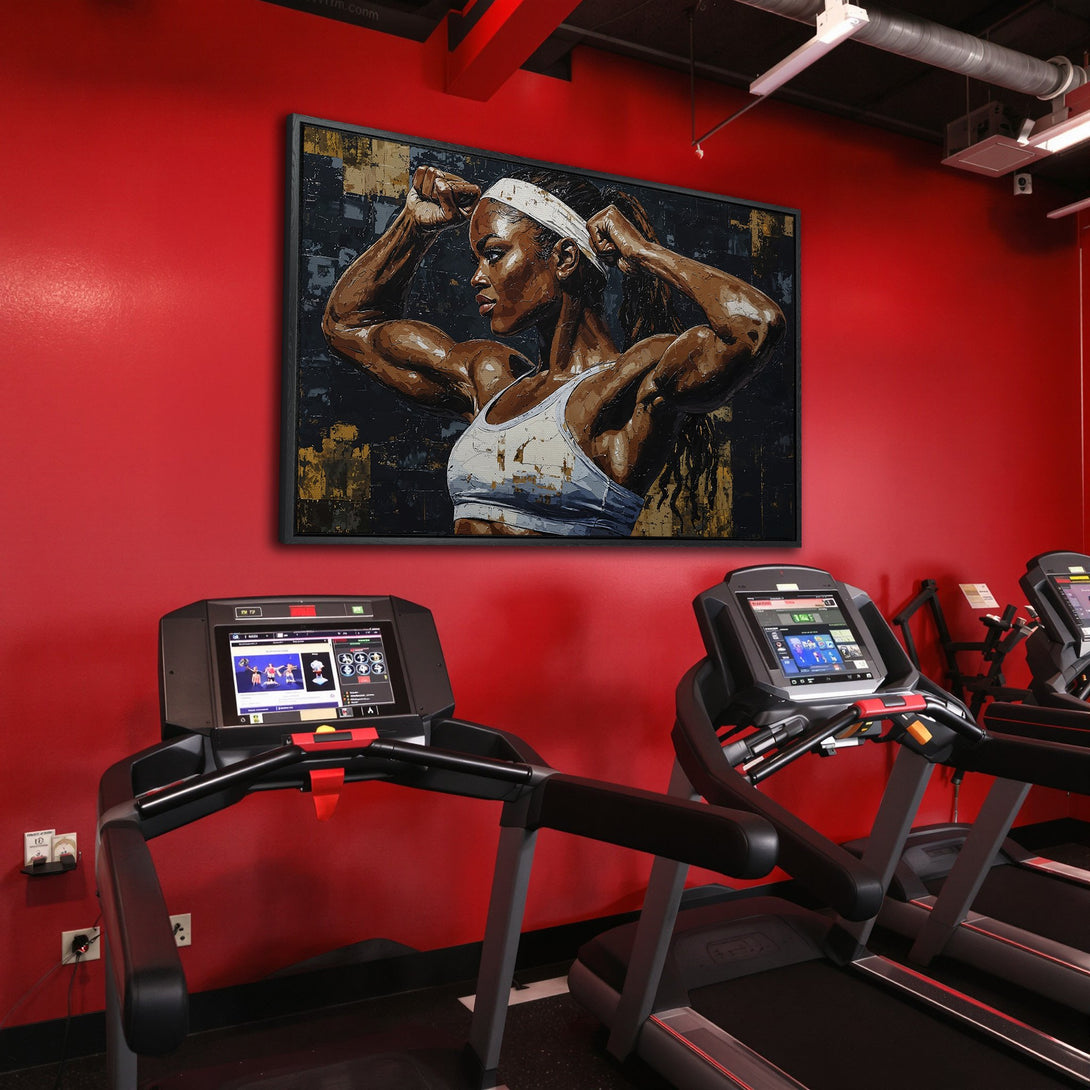 Framed Wall Art of a strong woman in a gym. Bold, modern art with a red and black color palette. Perfect for a fitness space!