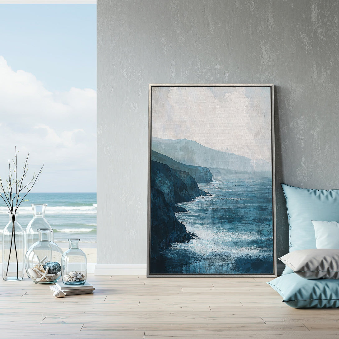 Framed Wall Art featuring an abstract coastal landscape in blue hues. Bring the serenity of the ocean into your home with this stunning canvas print.