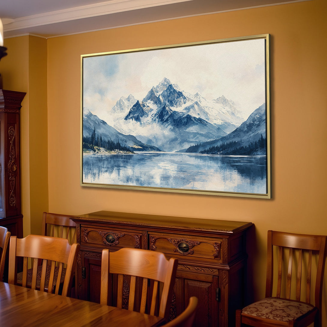 Canvas Print of a serene mountain landscape in cool blue tones, displayed in a cozy living room setting. Perfect for adding a touch of nature.
