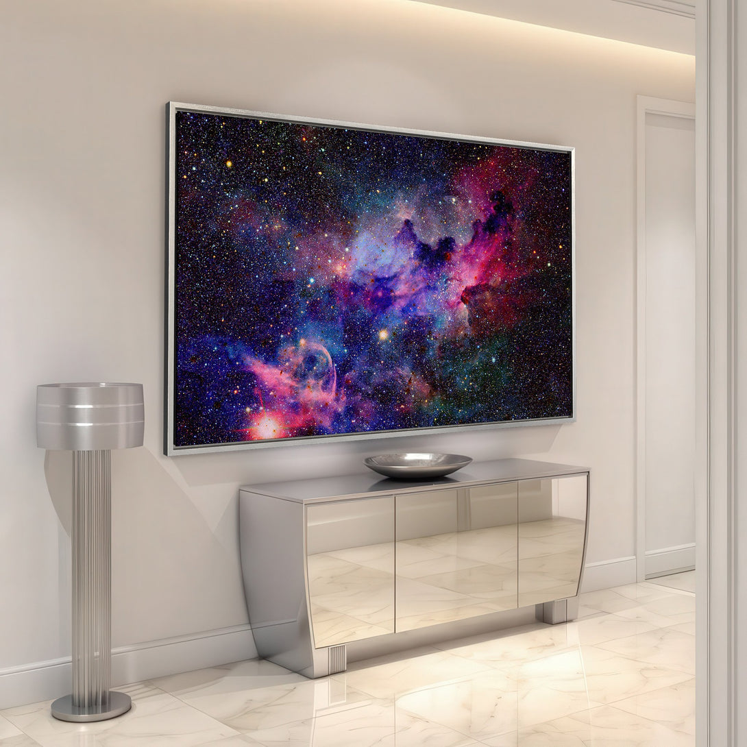 Framed Wall Art of a vibrant nebula in a modern interior. Colorful Canvas Print with blues, purples, and pinks adds cosmic style to any space.