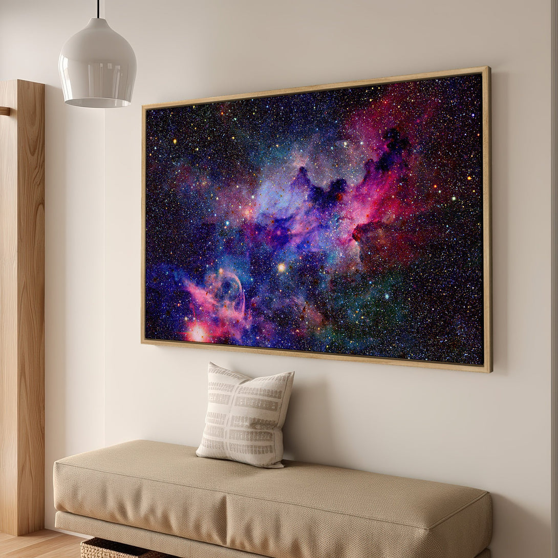 Framed Wall Art of a vibrant nebula in space. Stunning cosmic Canvas Print with a palette of deep blues, purples, and reds. Perfect for modern decor.