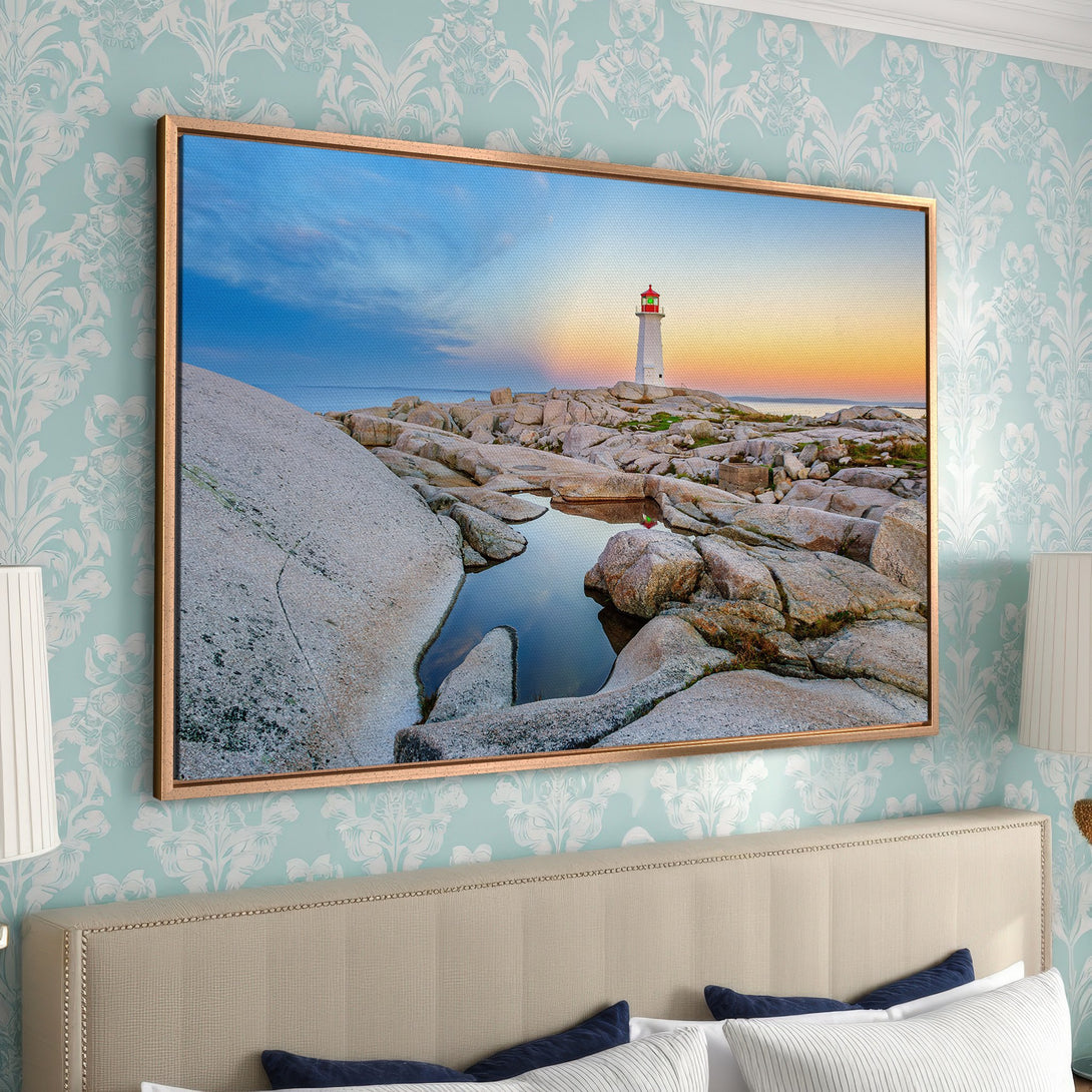 Framed Wall Art: Lighthouse Canvas Print with coastal landscape, warm sunset hues, and serene blues. Perfect for adding a touch of nature to your home.