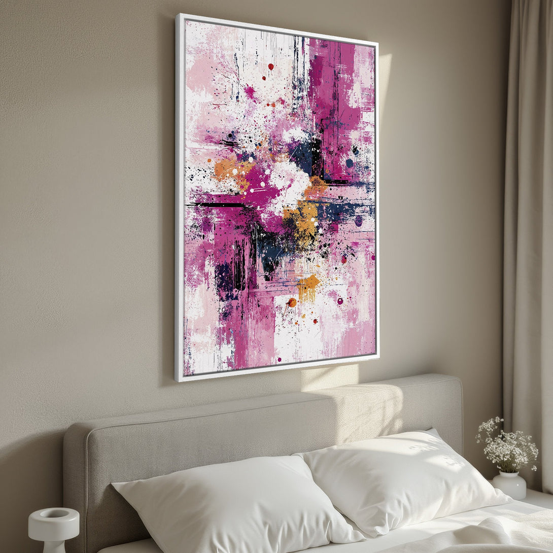 Framed Wall Art: Abstract art canvas print in a bedroom. Features a vibrant pink, white, and black color palette. Modern decor for any space.
