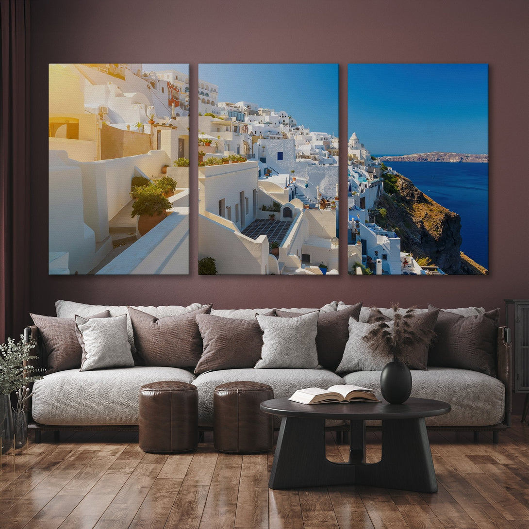 Canvas Print of Santorini, Greece. Coastal landscape art in a bright, airy style with white buildings, blue sea, and a warm color palette.