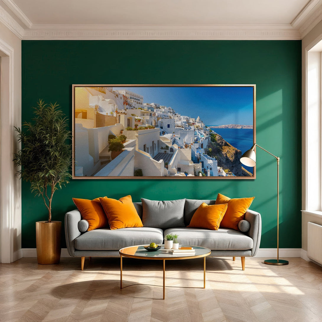 Framed Wall Art: Santorini Canvas Print in a modern interior. Features a vibrant blue and white landscape, adding a touch of Mediterranean charm.