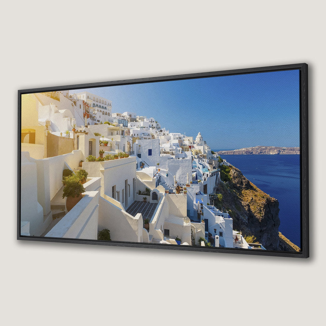 Framed Wall Art Canvas Print of Santorini, Greece. Coastal village with white buildings, blue sea, and sky. Mediterranean style, vibrant colors.