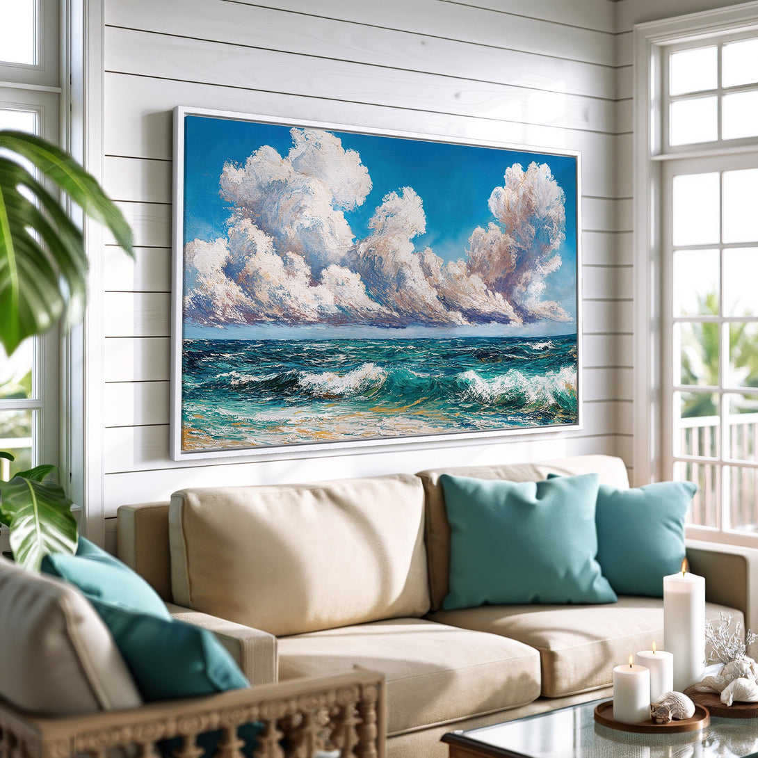 Framed Wall Art: Ocean waves and cloudscape painting in a coastal style. Features a blue, teal, and white color palette, perfect for living room decor.