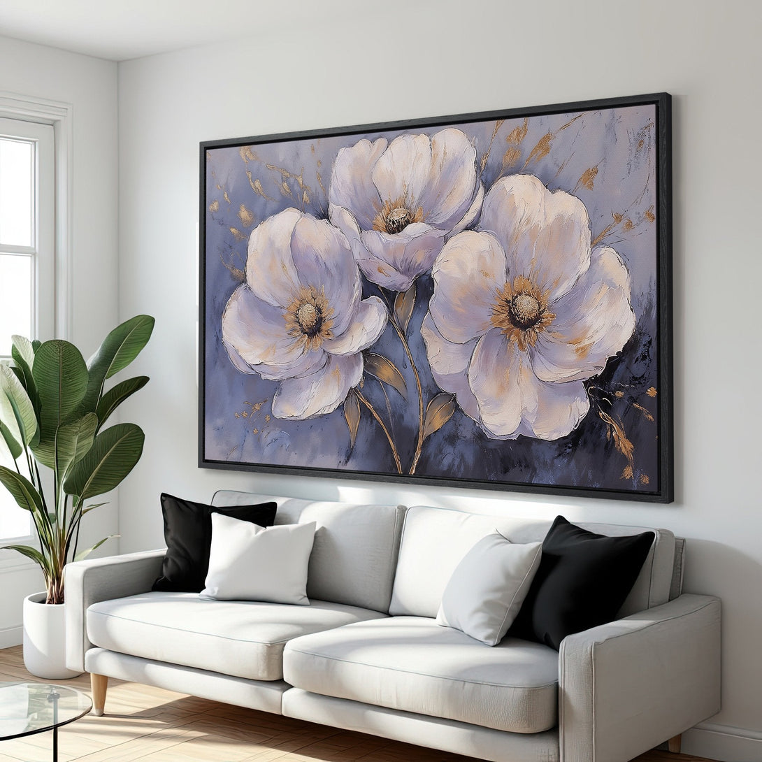 Framed Wall Art: Elegant floral Canvas Print in a modern interior. Features large white flowers with gold accents on a blue-grey background. Perfect home decor!