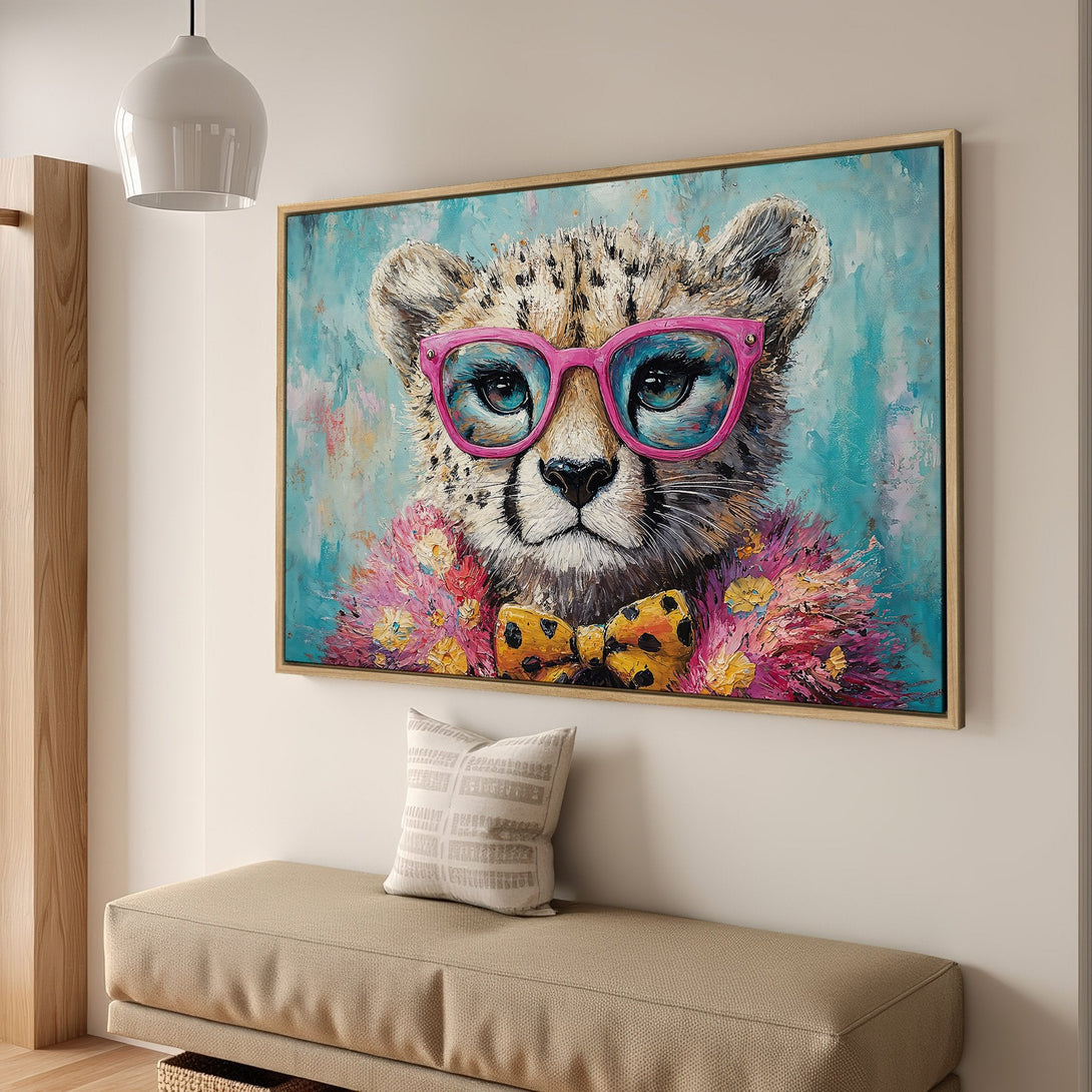Framed Wall Art: Playful cheetah portrait with pink glasses, vibrant teal & pink palette. Modern animal art for stylish home decor.