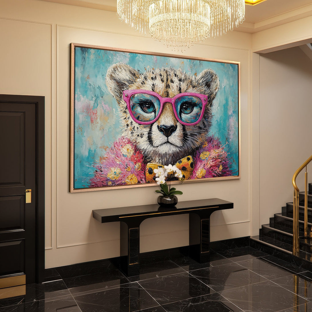 Framed Wall Art: Playful cheetah portrait with pink glasses, vibrant teal & pink palette. Modern, stylish decor for your home.