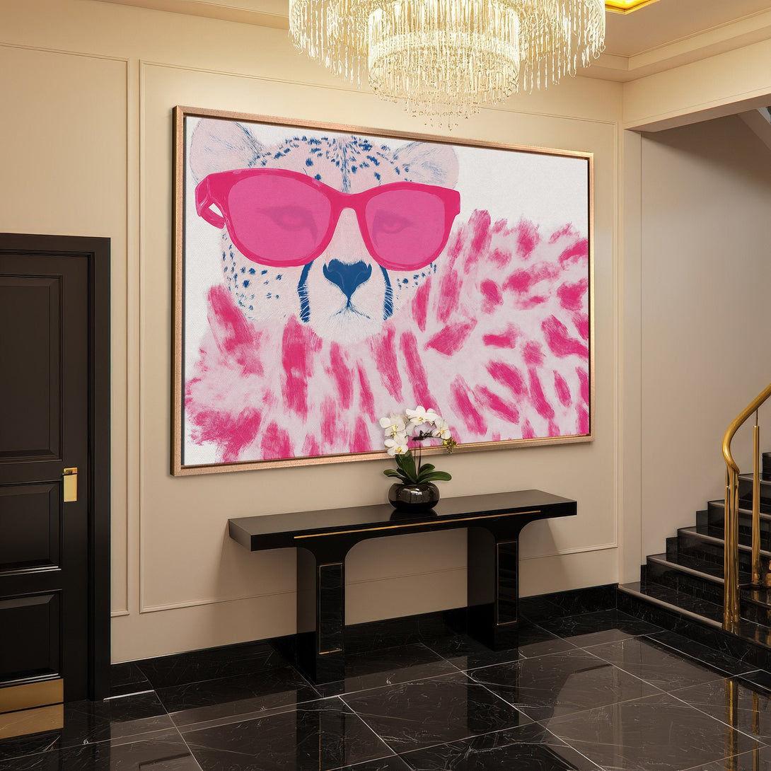 Framed Wall Art: Pop art cheetah with pink sunglasses. Modern canvas print in a chic interior, featuring a bold pink and blue color palette.