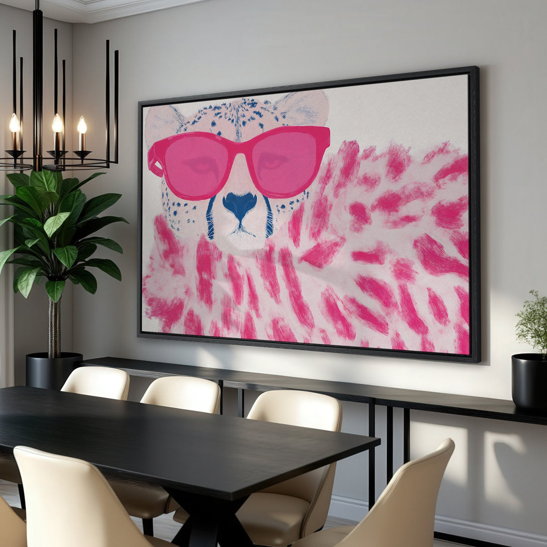 Framed Wall Art: Cool cheetah with pink sunglasses. Modern, pop art style with a vibrant pink and blue color palette. Perfect for stylish home decor.