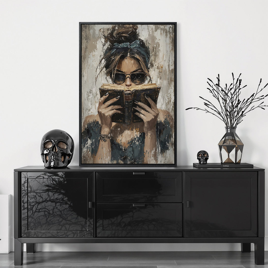 Framed Wall Art featuring a woman reading, painted in a modern, neutral palette. Perfect for adding a touch of sophistication to any space.
