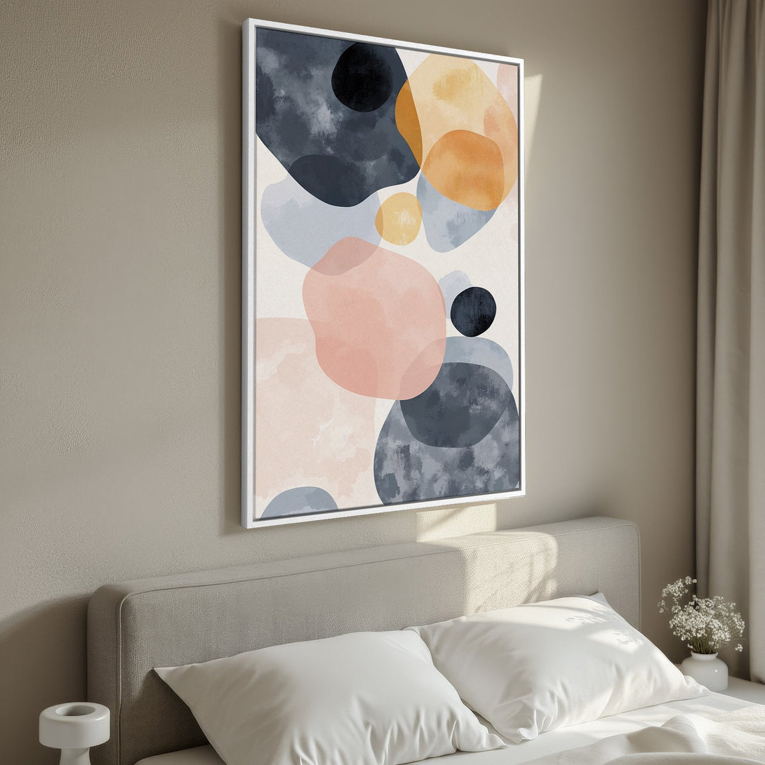 Framed Wall Art featuring abstract watercolor shapes in muted blues, pinks, and oranges. Modern art canvas print for bedroom decor.