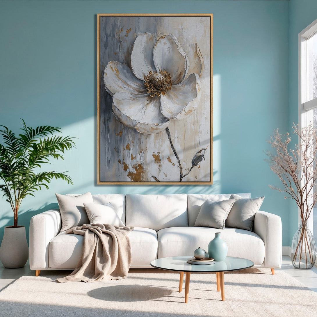 Framed Wall Art featuring a large white flower in a modern abstract style with gold accents. Soft, neutral color palette perfect for any home.