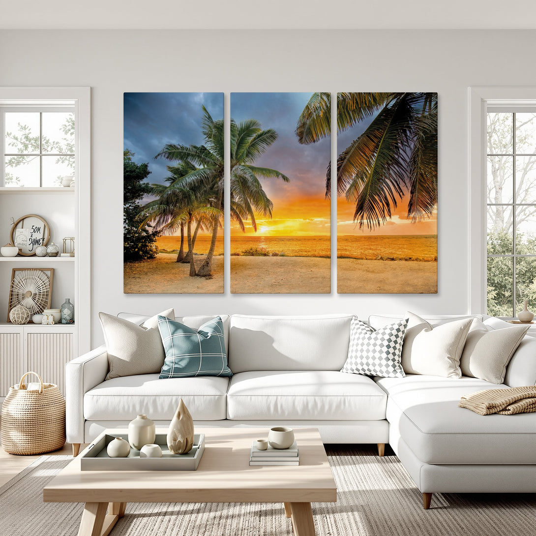 Canvas Print of tropical beach sunset with palm trees. Warm orange, yellow, and blue hues. Coastal wall art for a relaxing vibe.
