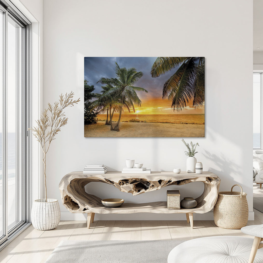 Framed Wall Art: Tropical beach sunset Canvas Print with palm trees. Warm orange, yellow, and blue color palette. Perfect for coastal decor.