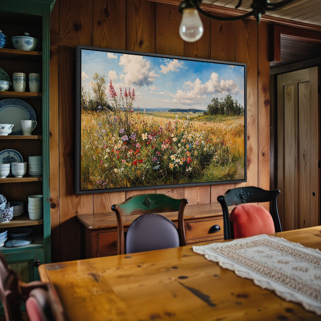 Framed Wall Art: Landscape Canvas Print featuring a vibrant field of wildflowers under a blue sky. Warm, inviting color palette perfect for home decor.