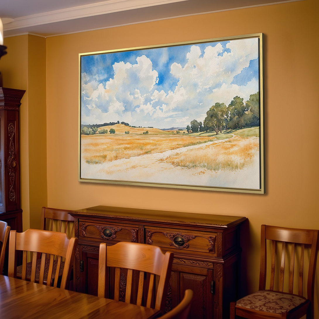 Canvas Print of a watercolor landscape painting in a warm, neutral interior. Features a field, blue sky, and soft color palette.