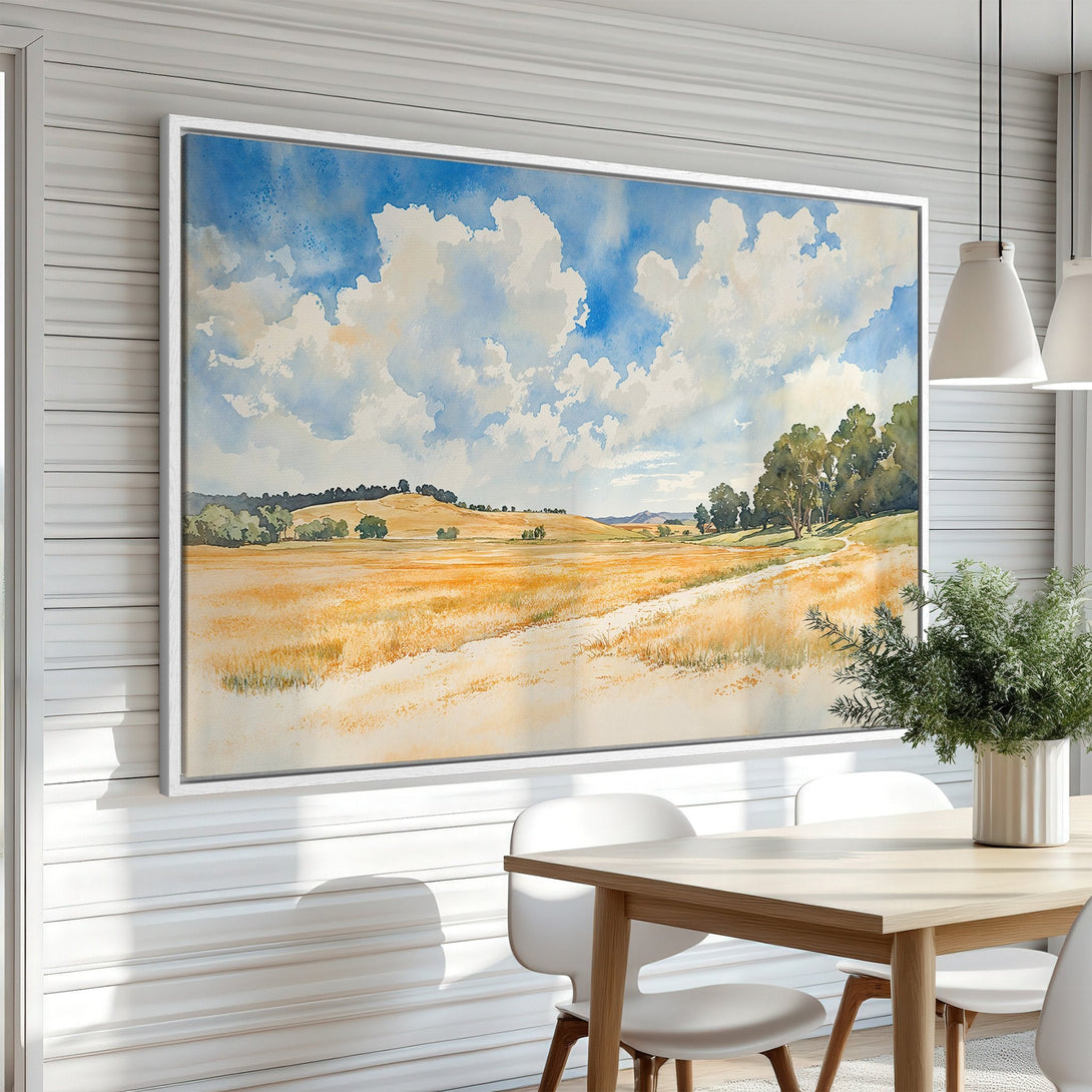 Framed Wall Art featuring a watercolor landscape of a field and sky. Warm yellow, blue, and green tones create a serene and inviting atmosphere. Perfect for any home.