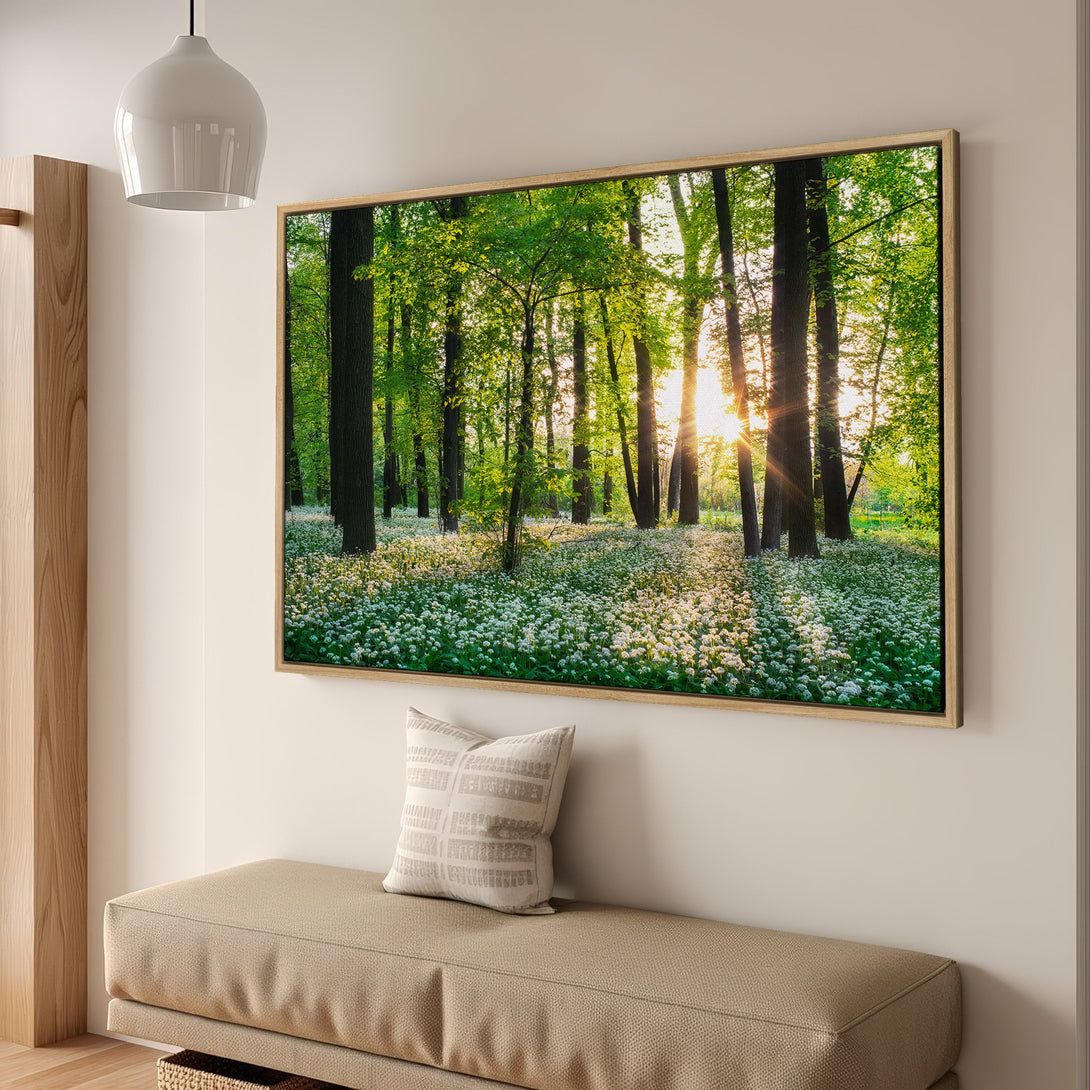 Framed Wall Art: Serene forest scene Canvas Print with vibrant greens, whites, and golden sunlight. Bring nature's beauty indoors with this stunning artwork.