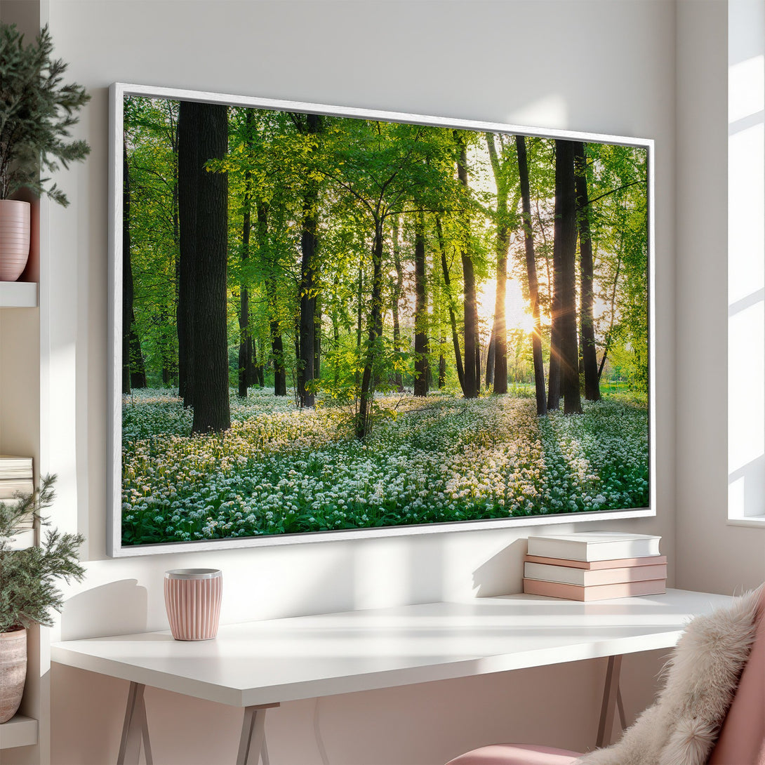Framed Wall Art of a lush forest scene with green leaves and white flowers. Natural light and a serene, calming color palette. Perfect for home decor.