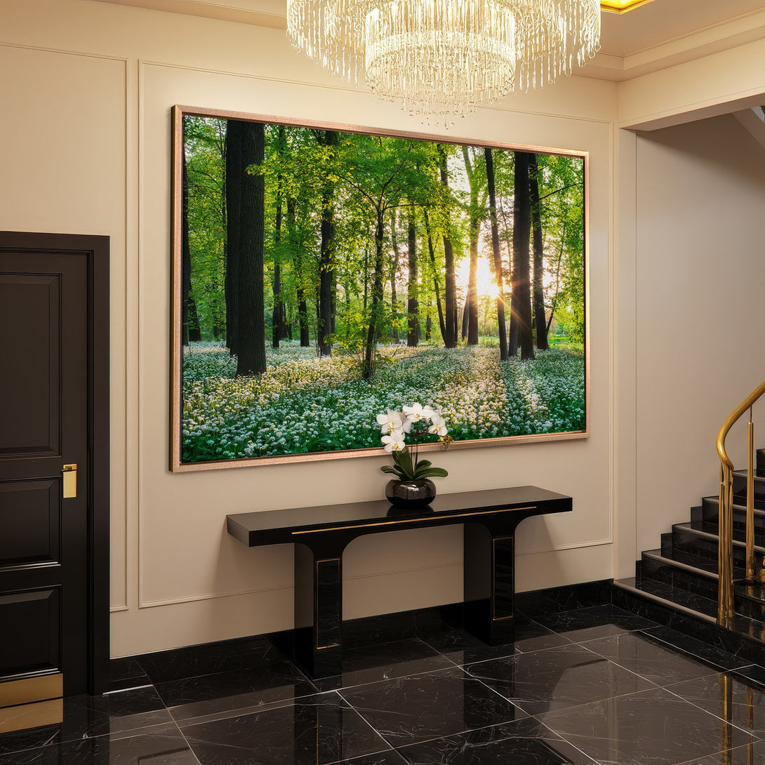 Framed Wall Art of a vibrant forest scene with green and white hues, adding a touch of nature to a luxurious interior.